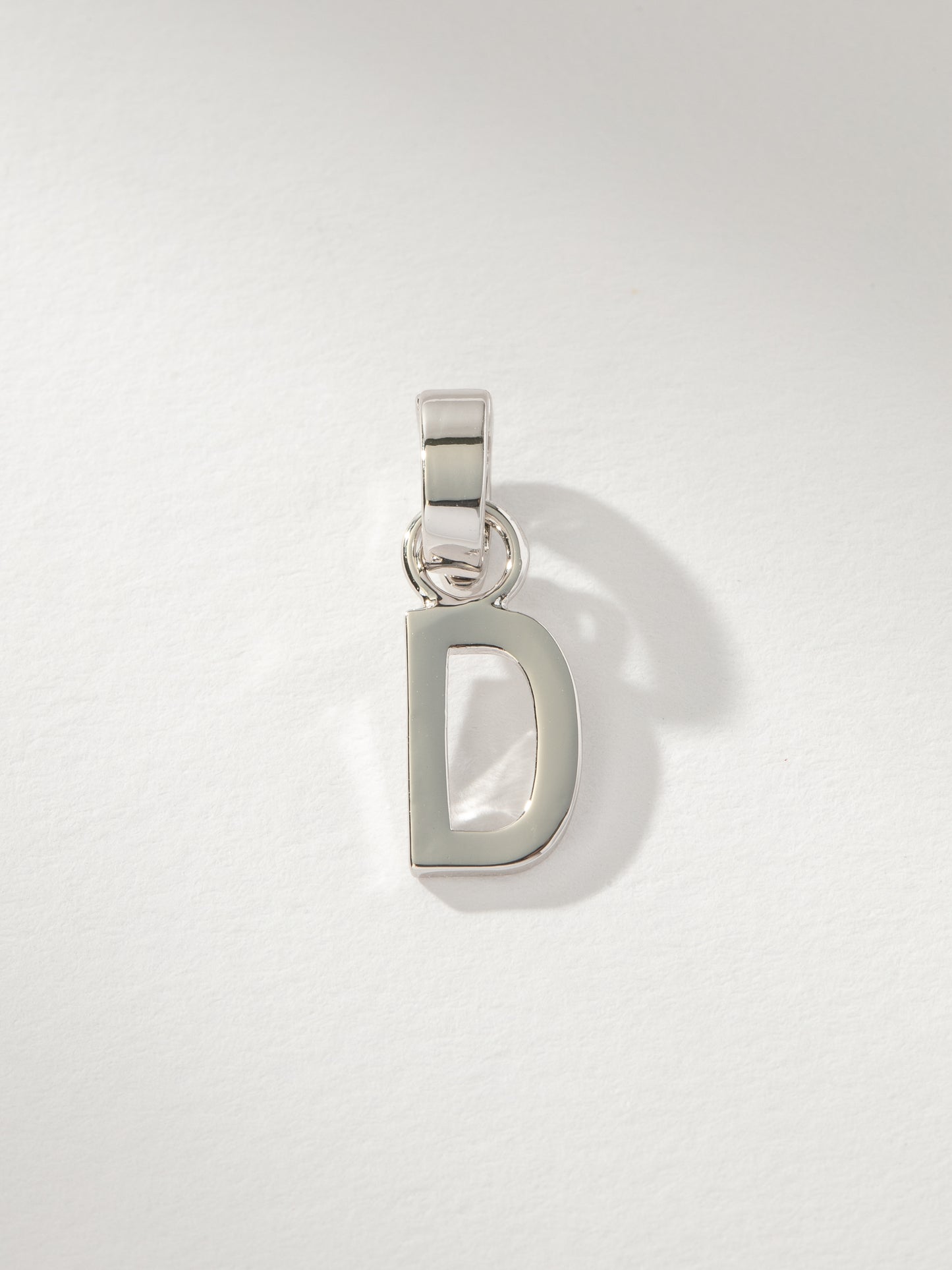 Letter Charm | Silver Solid D | Product Image | Uncommon James