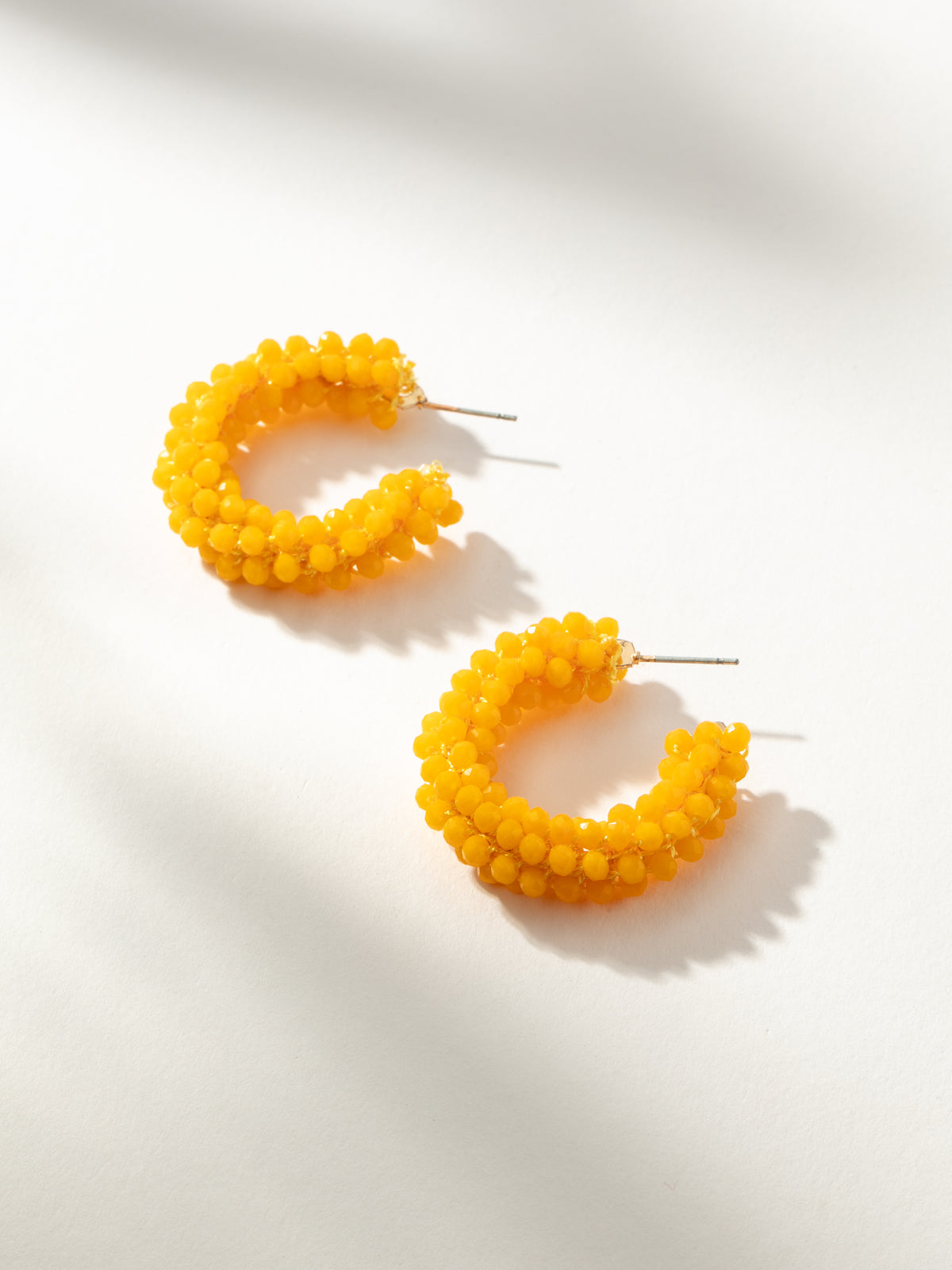 Sassy Jones Yellow and Blue Fabric Hoop Earrings Brent Neale Cabochon Blue Topaz Huggie Hoop Earrings main image 3