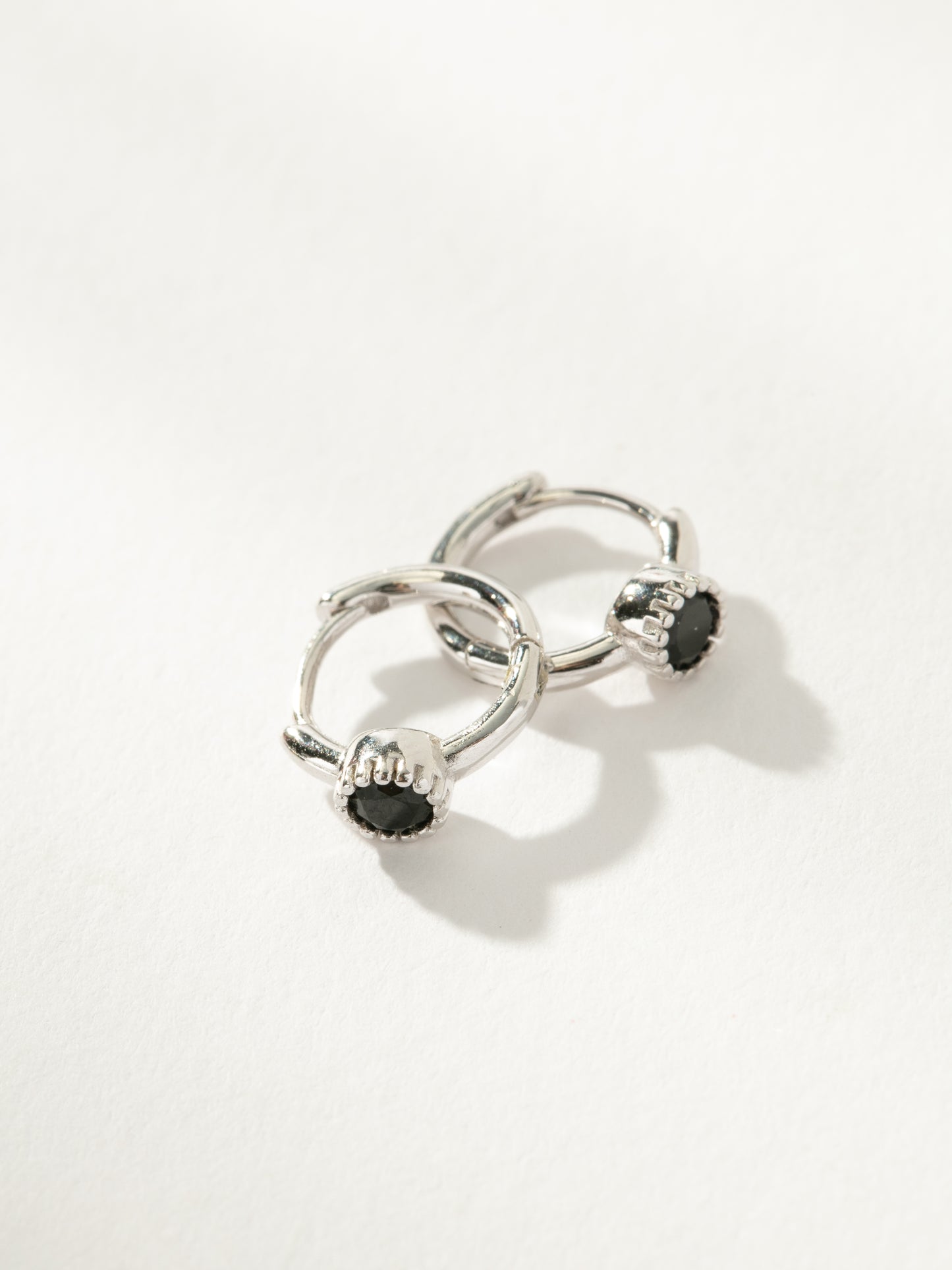 Center Stage Huggie Earrings | Sterling Silver Black| Product Detail Image | Uncommon James