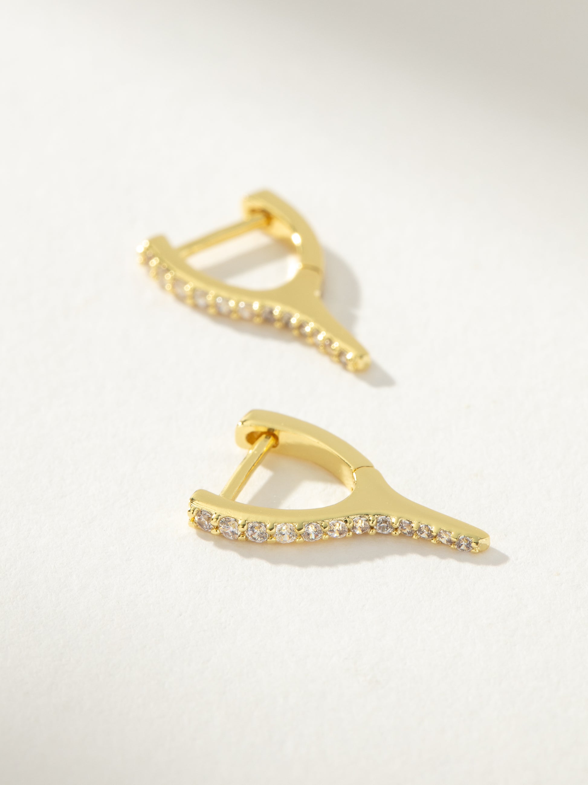 Wishbone Pavé Huggie Earrings | Gold | Product Detail Image | Uncommon James