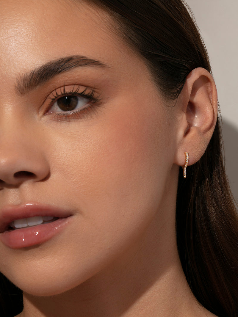 Wishbone Pavé Huggie Earrings | Gold | Model Image | Uncommon James