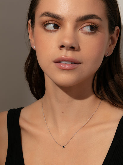 ["Black Hole Pendant Necklace ", " Sterling Silver ", " Model Image ", " Uncommon James"]