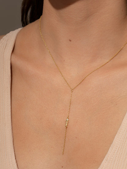 ["Fish Bone Lariat Necklace ", " Gold ", " Model Image ", " Uncommon James"]