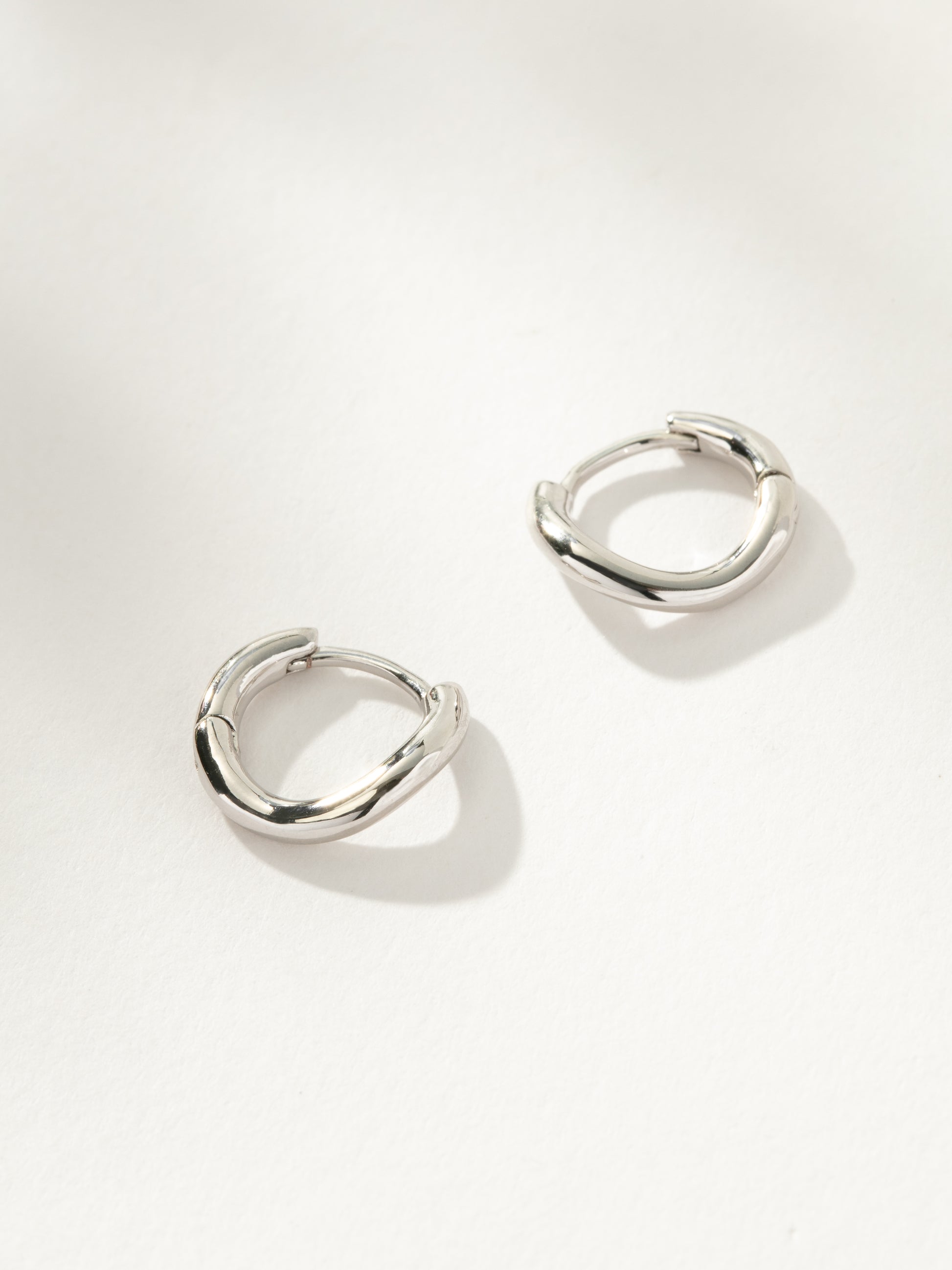 Curve Huggie Earrings | Silver | Product Image | Uncommon James