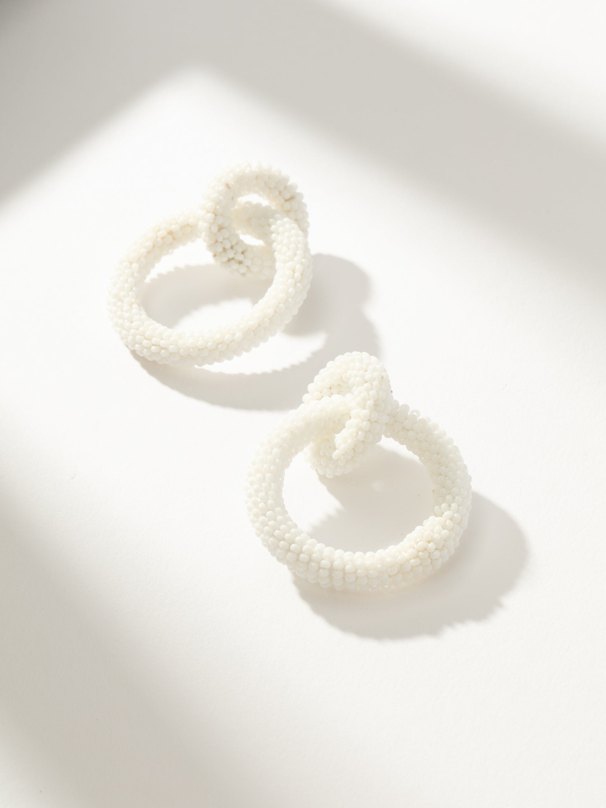 White Beaded Interlocking Hoop Earrings Uncommon James