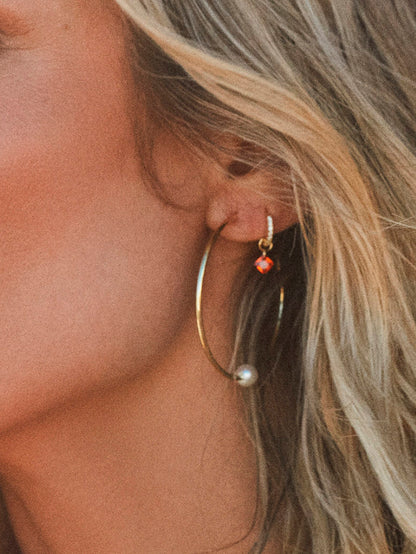 ["Paradise Huggie Earrings ", " Gold Orange ", " KC Image ", " Uncommon James"]