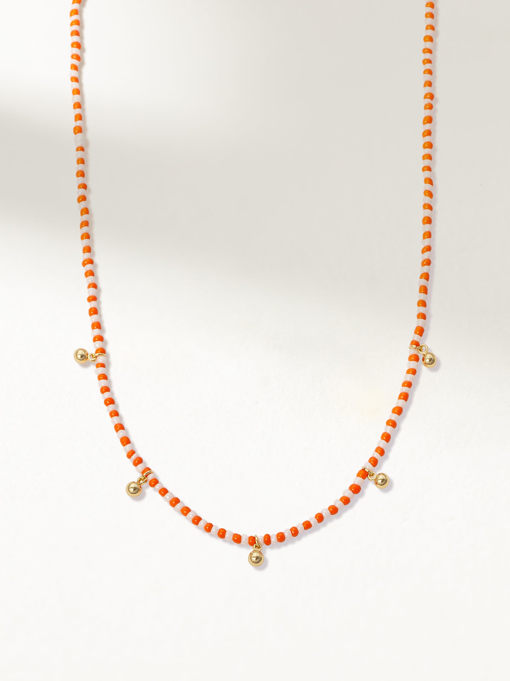 Sunset Beaded Necklace | Gold Orange/White | Product Image | Uncommon James