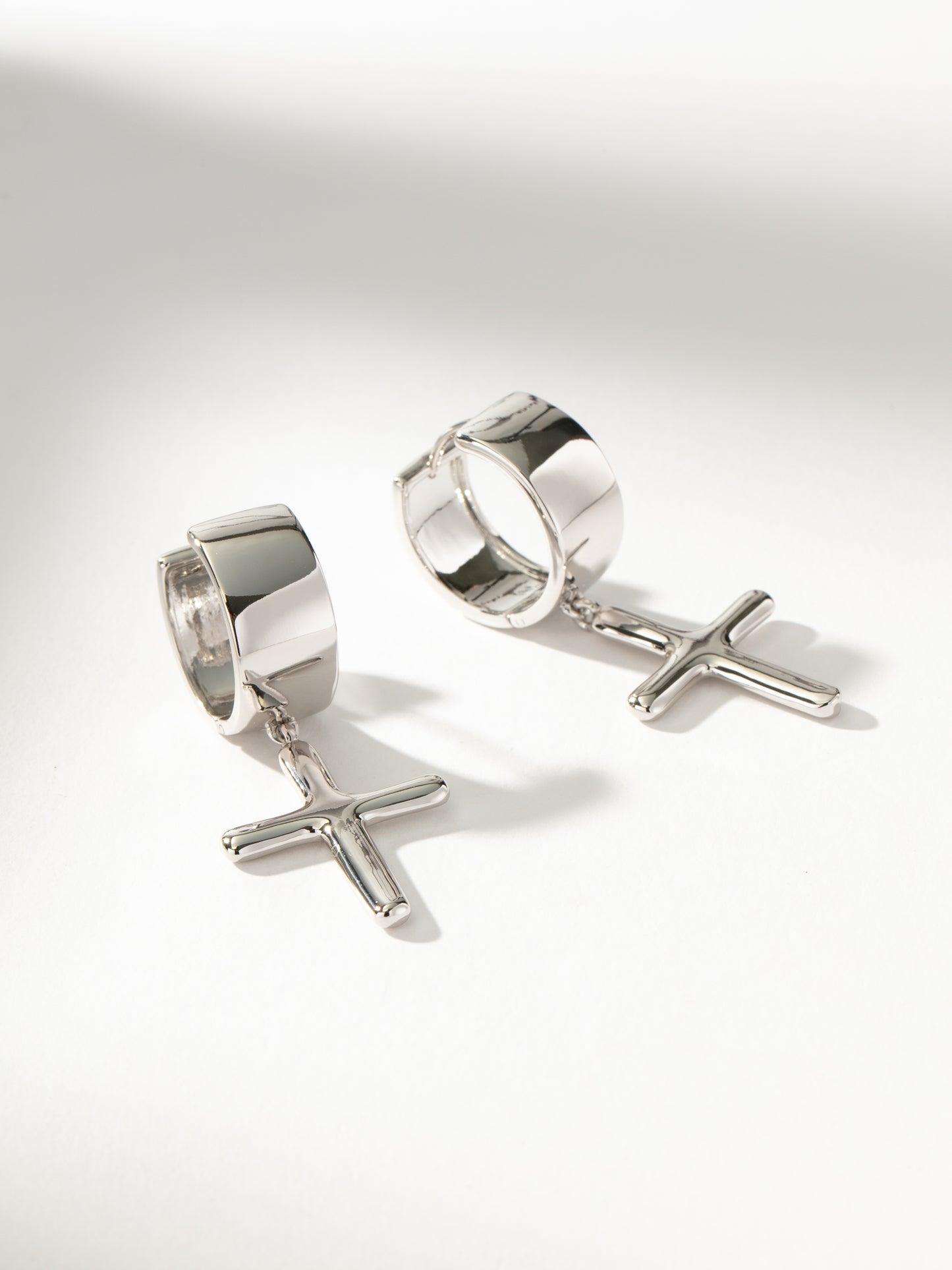 Chunky Cross Huggie Earrings | Silver | Product Image | Uncommon James