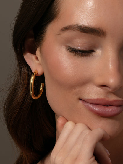 ["Effortless Tube Hoop Earrings ", " Gold ", " Model Image ", " Uncommon James"]