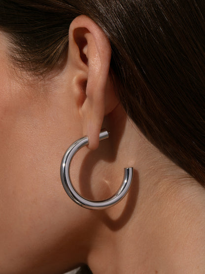 ["Effortless Tube Hoop Earrings ", " Silver ", " Model Image 2 ", " Uncommon James"]