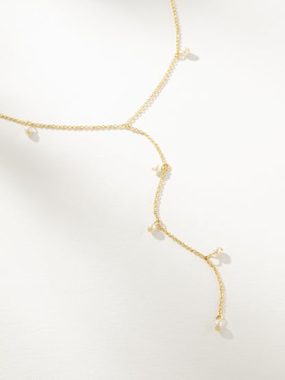 ["Pearl Lariat Necklace ", " Gold ", " Product Image ", " Uncommon James"]