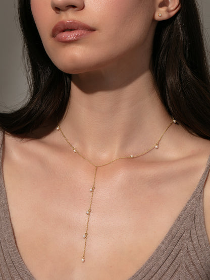 ["Pearl Lariat Necklace ", " Gold ", " Model Image ", " Uncommon James"]