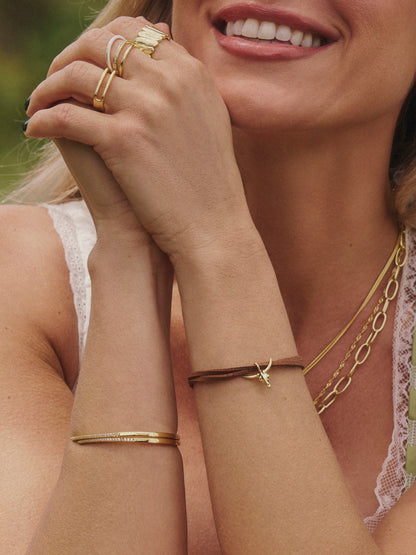 ["Out West Fighter Bracelet ", " Gold ", " Kristin Image ", " Uncommon James"]