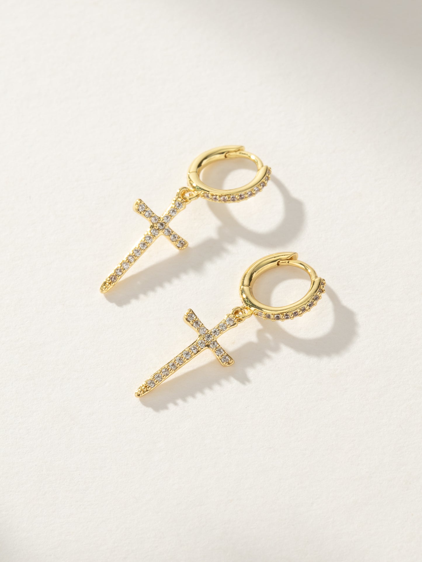 Higher Shine Cross Huggie Earrings | Gold | Product Image | Uncommon James