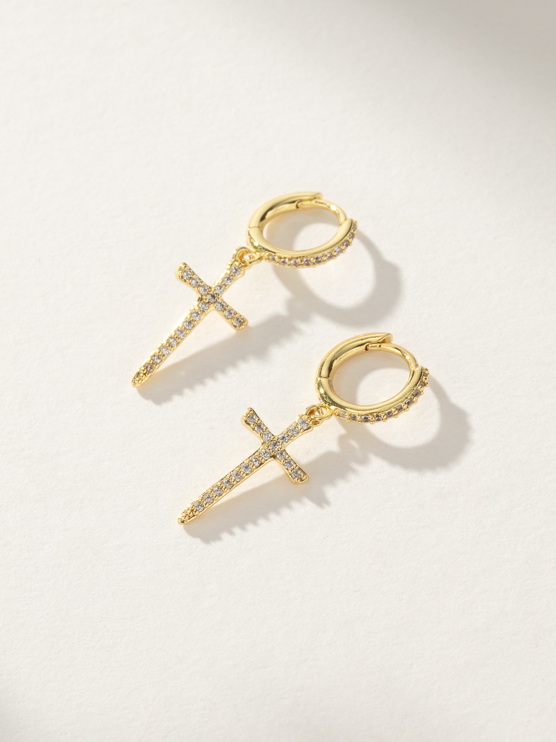 Higher Shine Cross Huggie Earrings | Gold | Product Image | Uncommon James