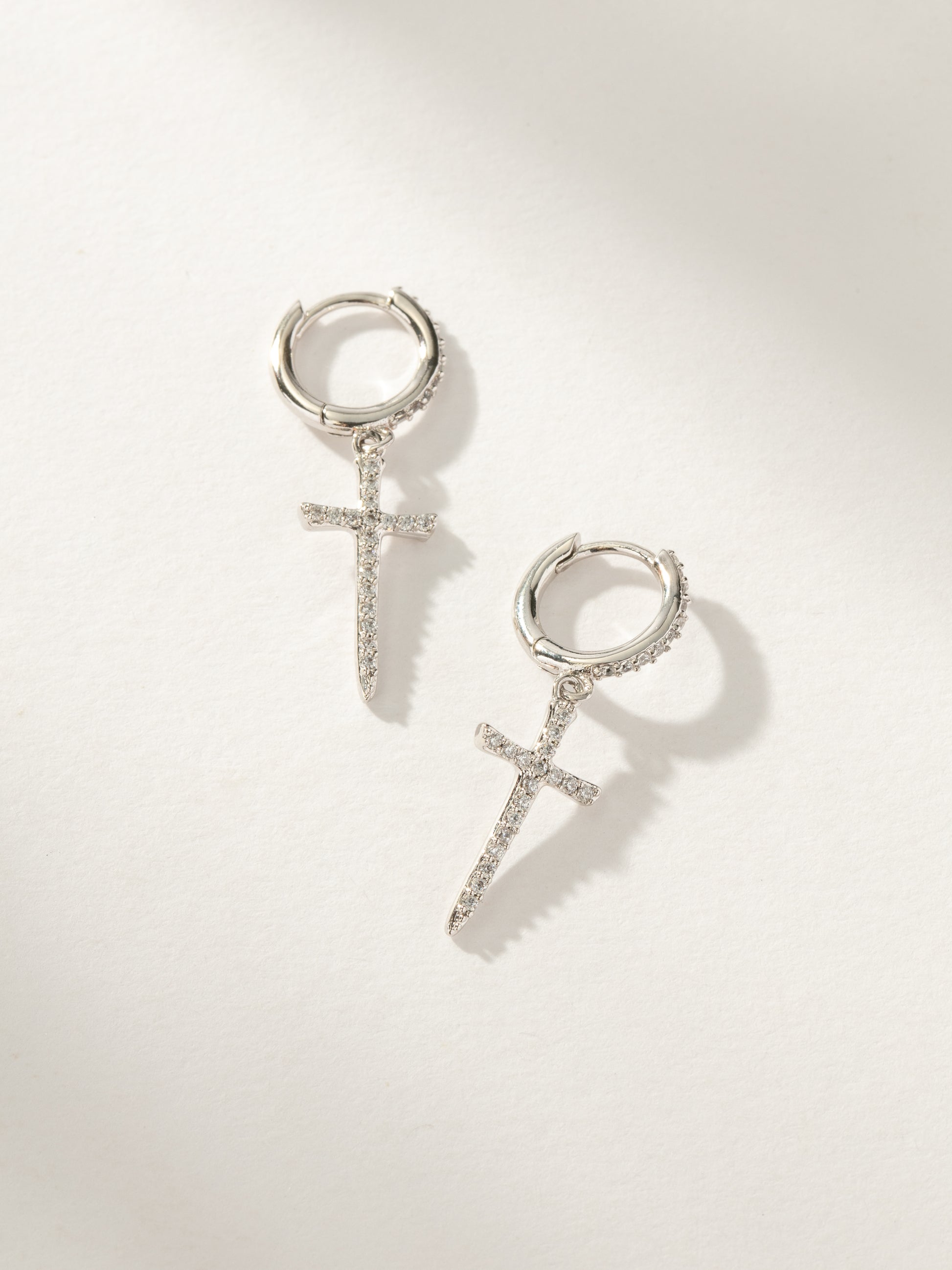 Higher Shine Cross Huggie Earrings | Silver | Product Image | Uncommon James