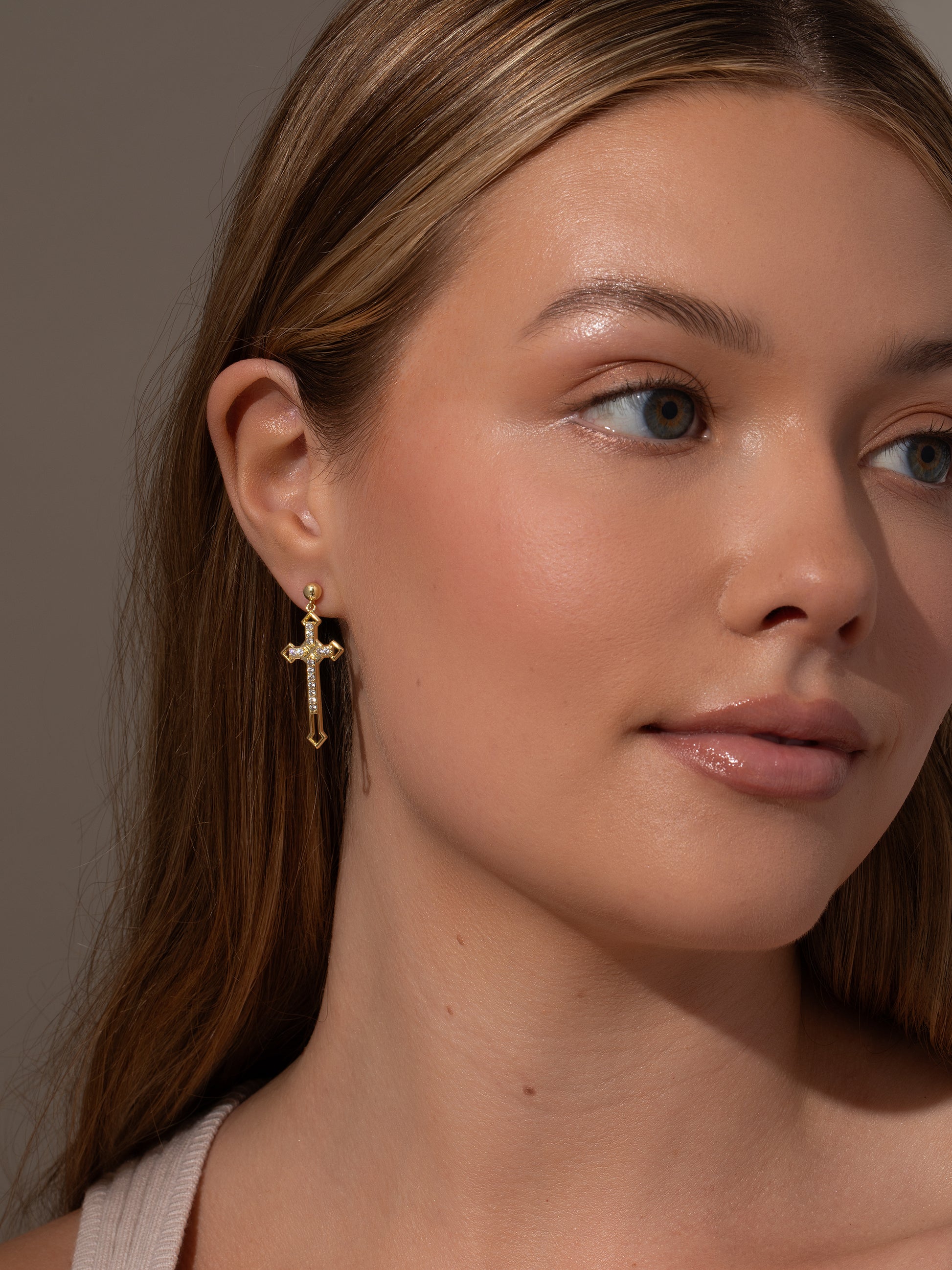 Powerful Statement Cross Earrings | Gold | Model Image | Uncommon James