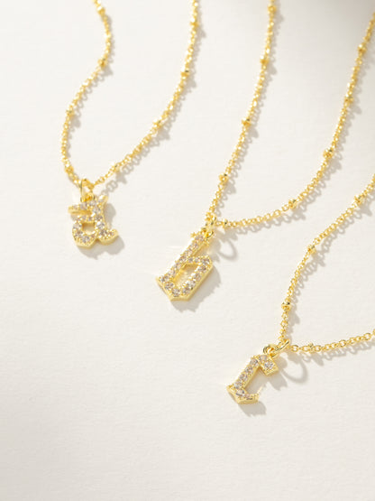 ["Made to Shine Initial Necklace ", " Gold ", " Group Image ", " Uncommon James"]