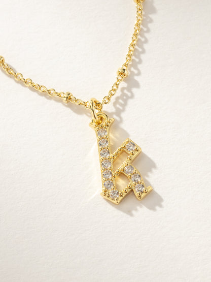 ["Made to Shine Initial Necklace ", " Gold K ", " Product Image ", " Uncommon James"]