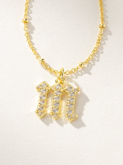 ["Made to Shine Initial Necklace ", " Gold M ", " Product Image ", " Uncommon James"]