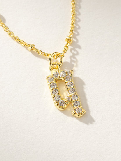 ["Made to Shine Initial Necklace ", " Gold Q ", " Product Image ", " Uncommon James"]