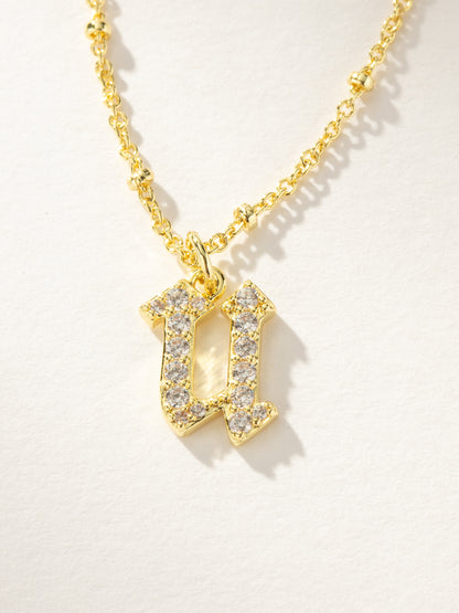 ["Made to Shine Initial Necklace ", " Gold U ", " Product Image ", " Uncommon James"]