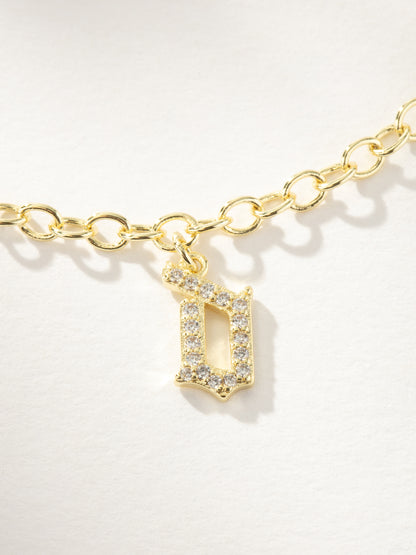 ["Gothic Glow Initial Bracelet ", " Gold D ", " Product Image ", " Uncommon James"]