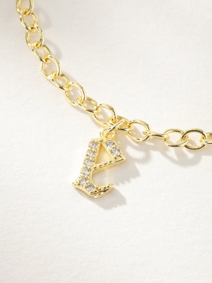 ["Gothic Glow Initial Bracelet ", " Gold E ", " Product Image ", " Uncommon James"]