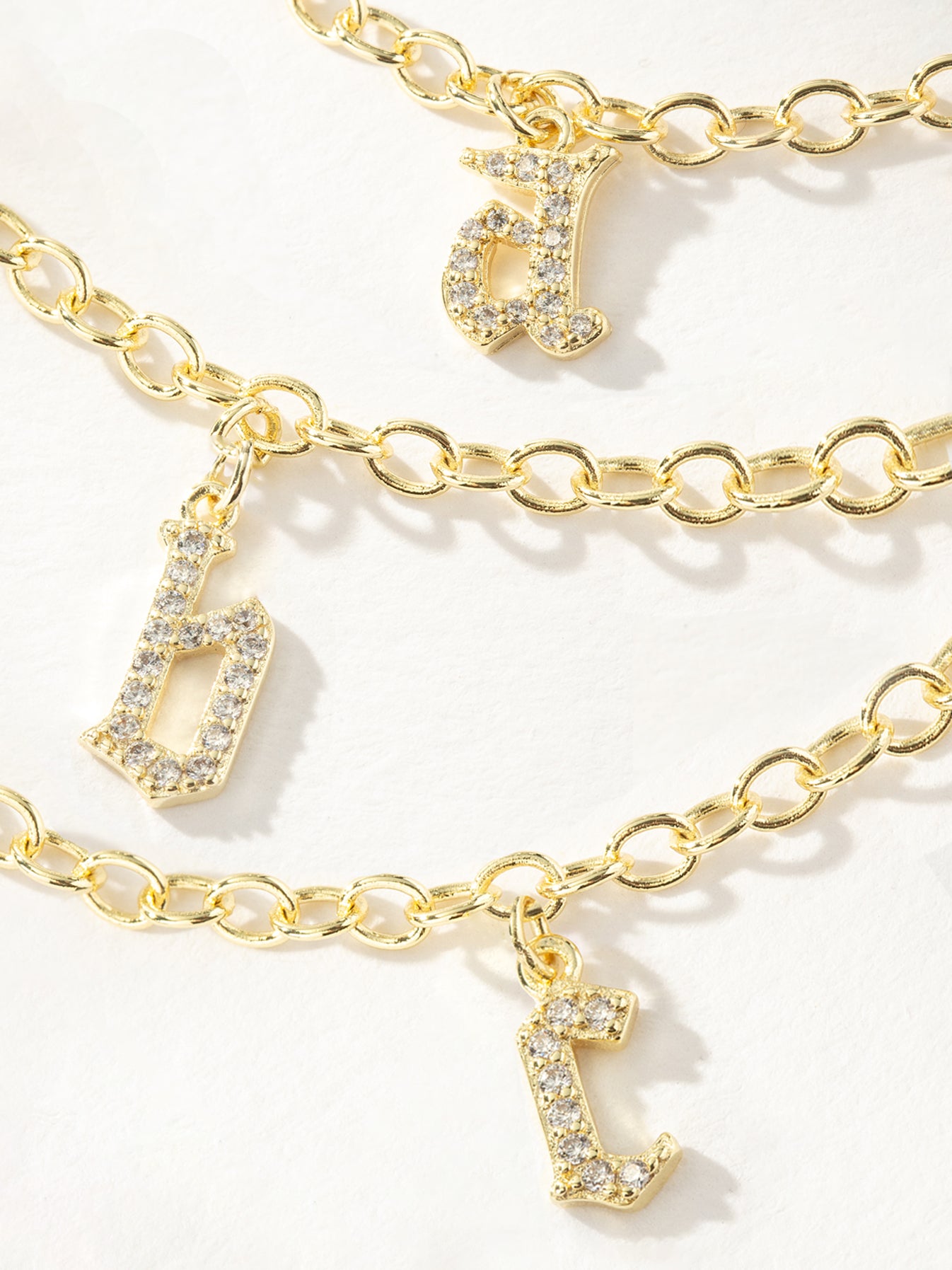 Gothic Glow Initial Bracelet | Gold | Group Image | Uncommon James