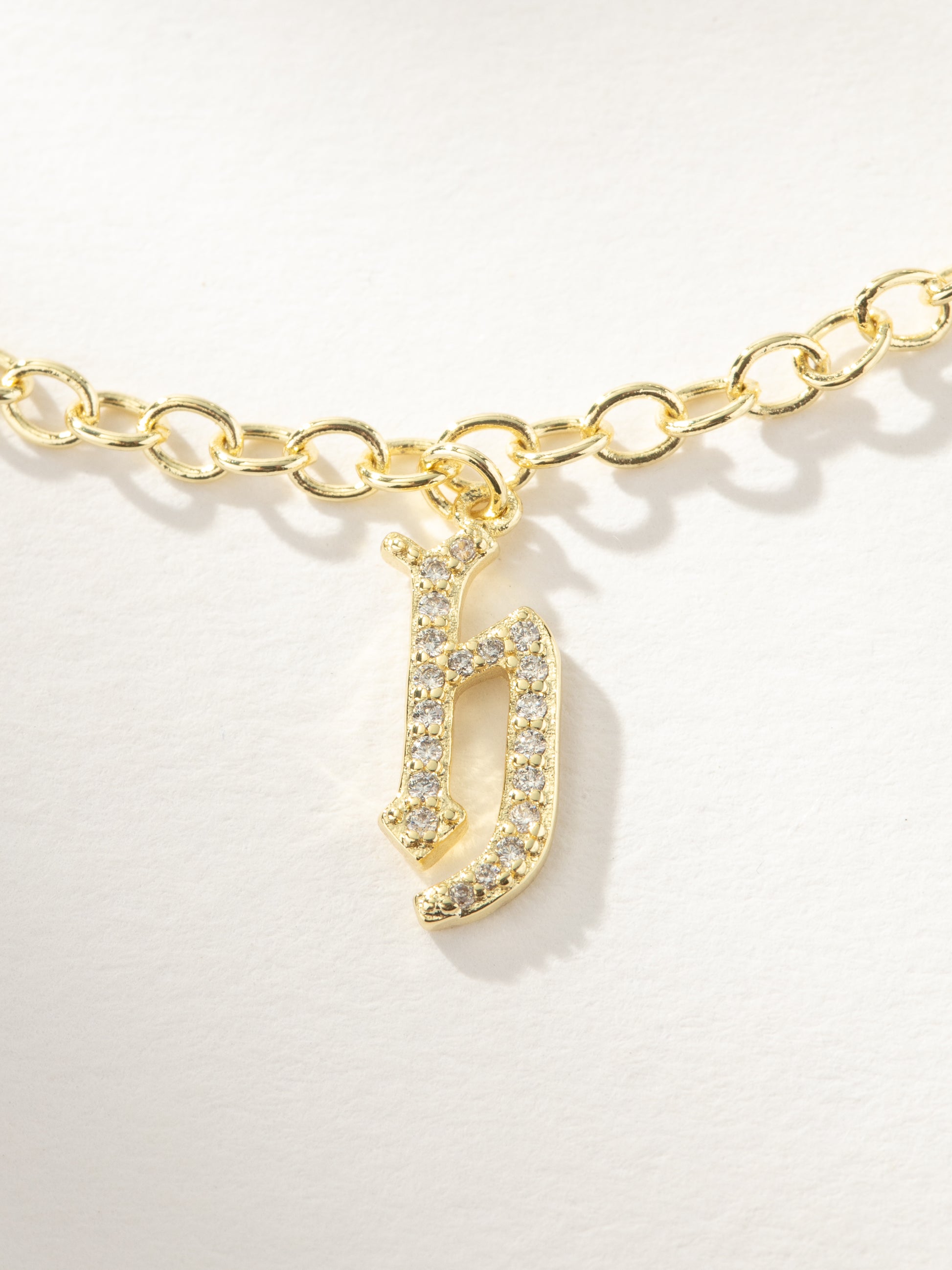 Gothic Glow Initial Bracelet | Gold H | Product Image | Uncommon James
