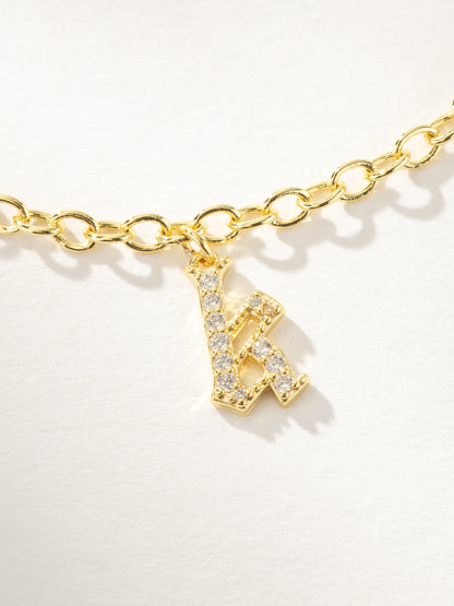 ["Gothic Glow Initial Bracelet ", " Gold K ", " Product Image ", " Uncommon James"]