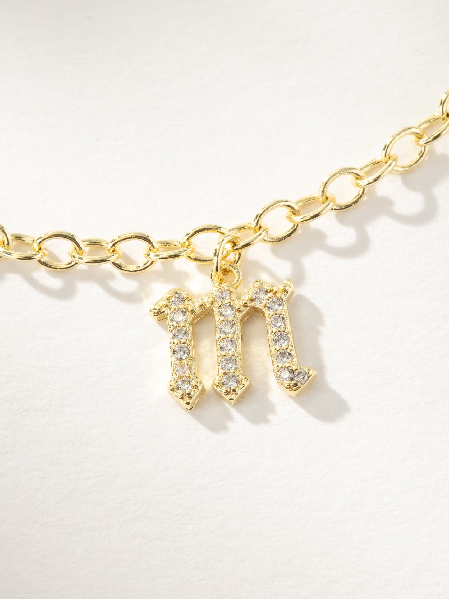Gothic Glow Initial Bracelet | Gold M | Product Image | Uncommon James
