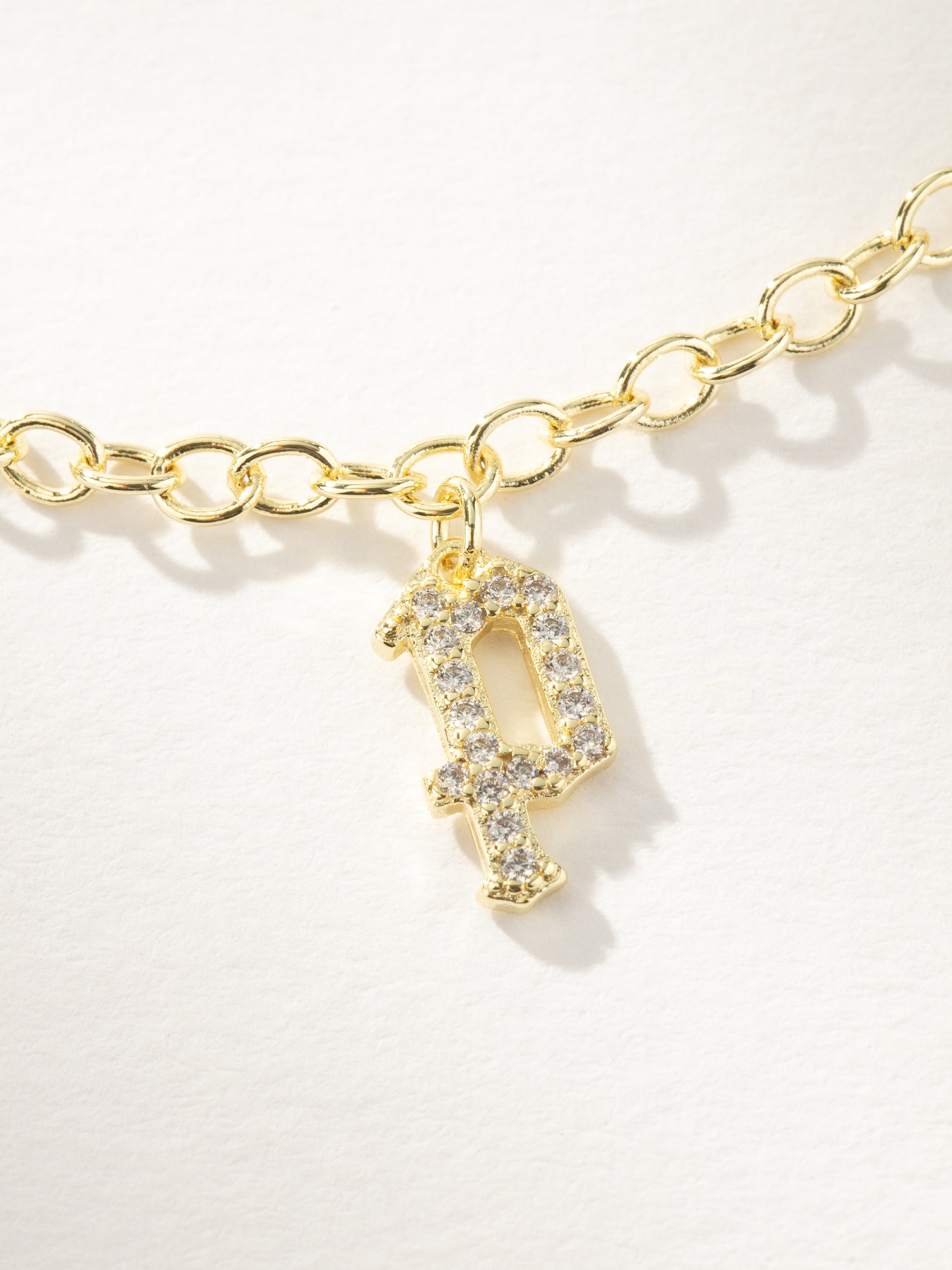 Gothic Glow Initial Bracelet | Gold P | Product Image | Uncommon James