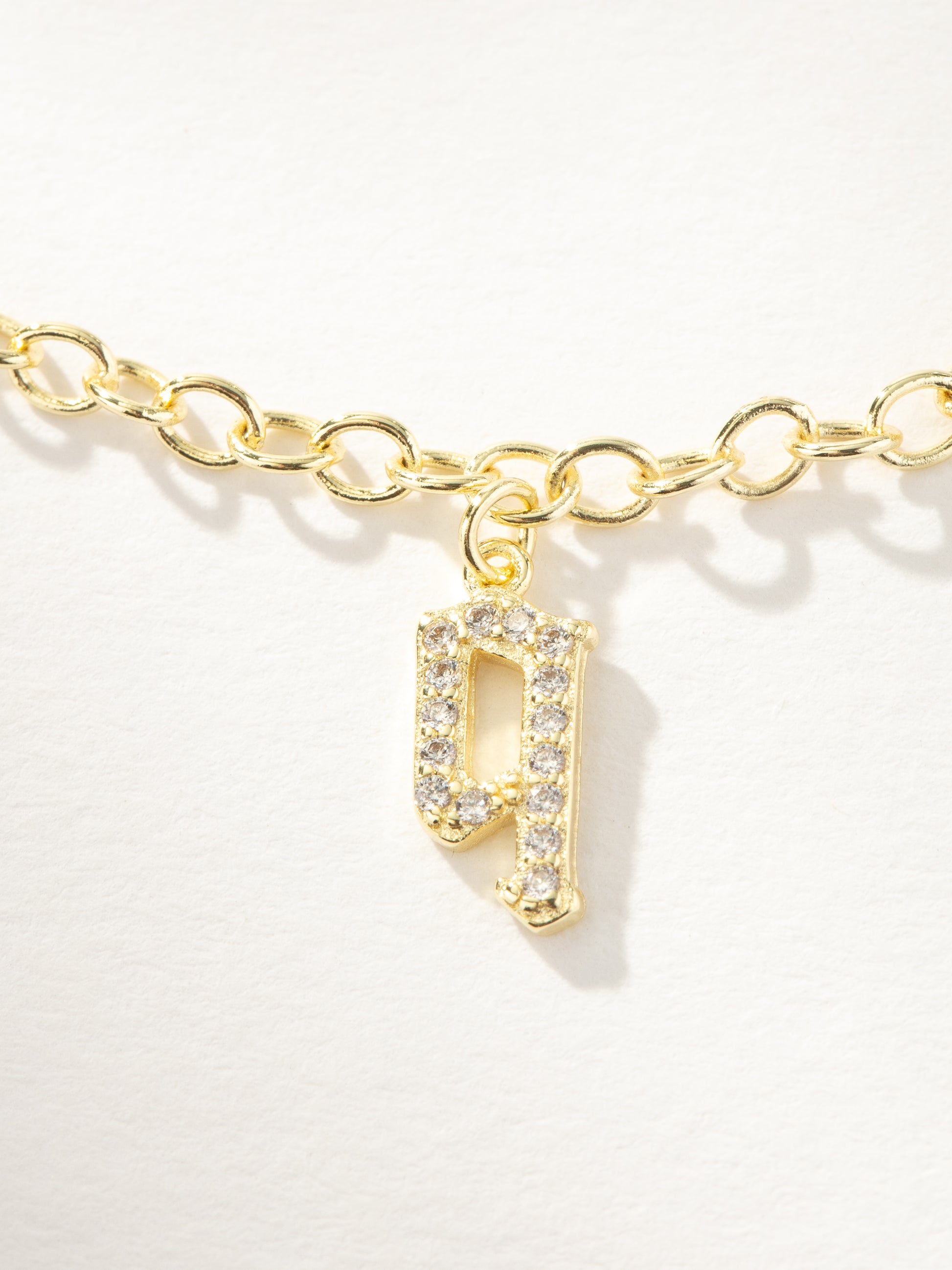 Gothic Glow Initial Bracelet | Gold Q | Product Image | Uncommon James