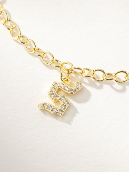 ["Gothic Glow Initial Bracelet ", " Gold S ", " Product Image ", " Uncommon James"]