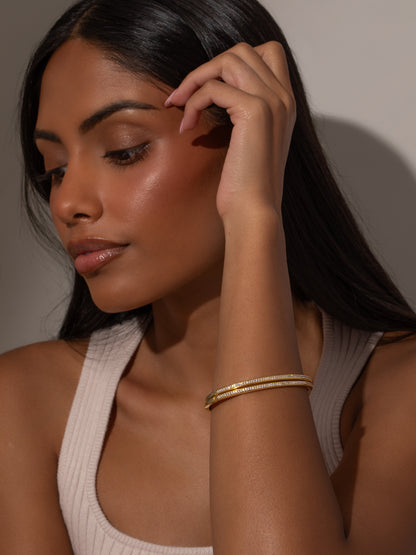 ["Radiant Glow Bracelet (Set of 2) ", " Gold ", " Model Image ", " Uncommon James"]