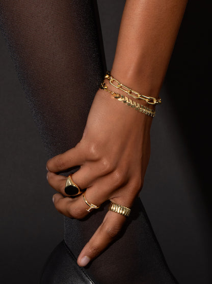 ["The Path Arrow Bracelet ", " Gold ", " Campaign Image ", " Uncommon James"]