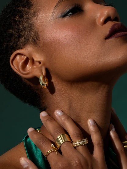 ["Artistic Twist Hoop Earrings ", " Gold ", " Campaign Image ", " Uncommon James"]