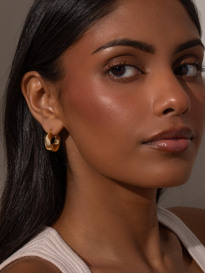 ["Artistic Twist Hoop Earrings ", " Gold ", " Model Image ", " Uncommon James"]