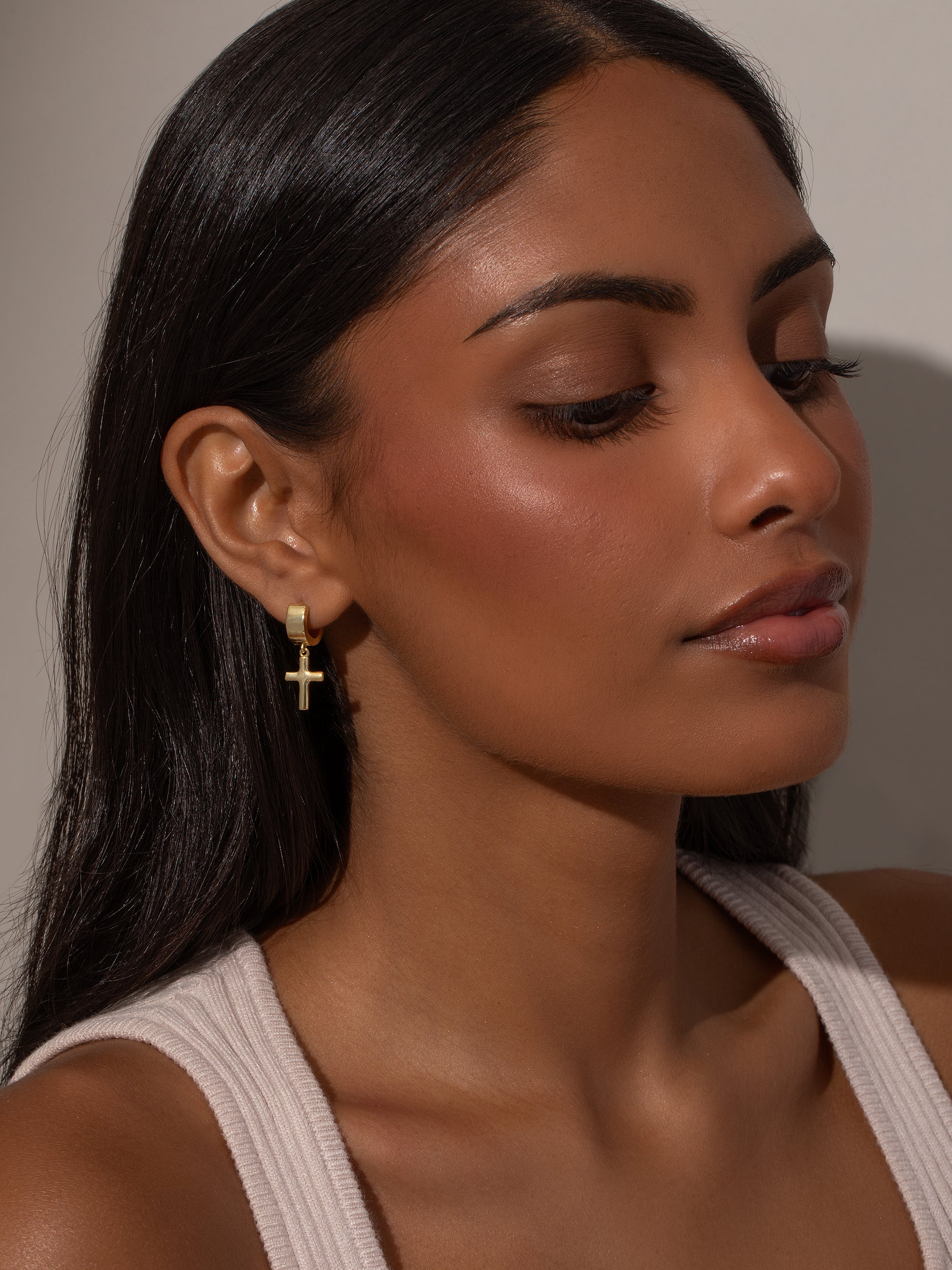 Bold Cross Huggie Earrings | Gold | Model Image | Uncommon James