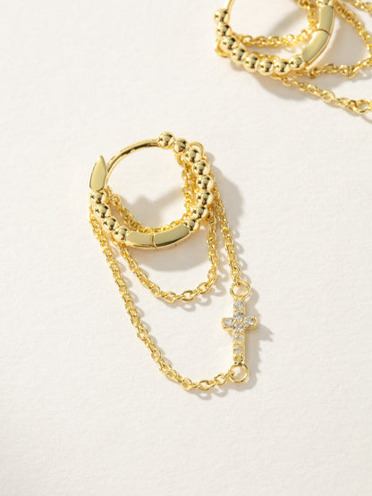 ["Cross and Chain Huggie Earrings ", " Gold ", " Product Image ", " Uncommon James"]