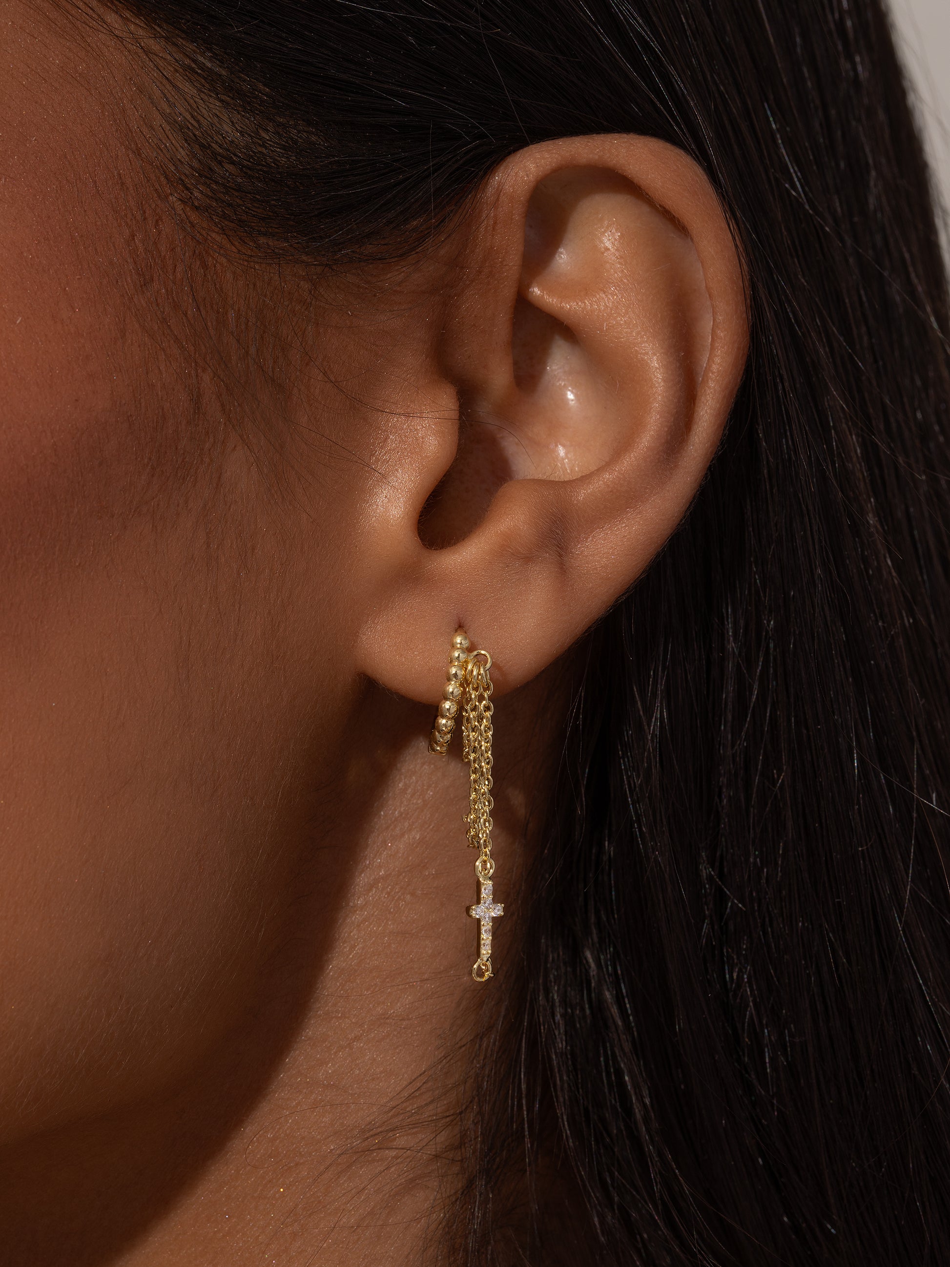 Cross and Chain Huggie Earrings | Gold | Model Image | Uncommon James