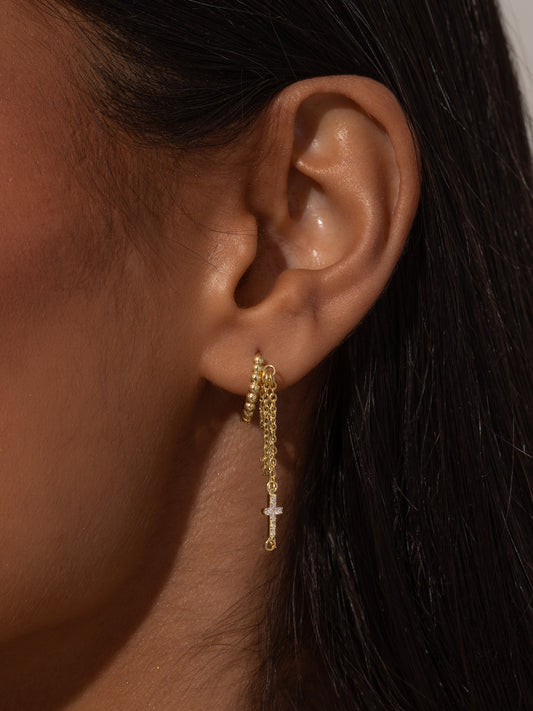 Cross and Chain Huggie Earrings | Gold | Model Image | Uncommon James