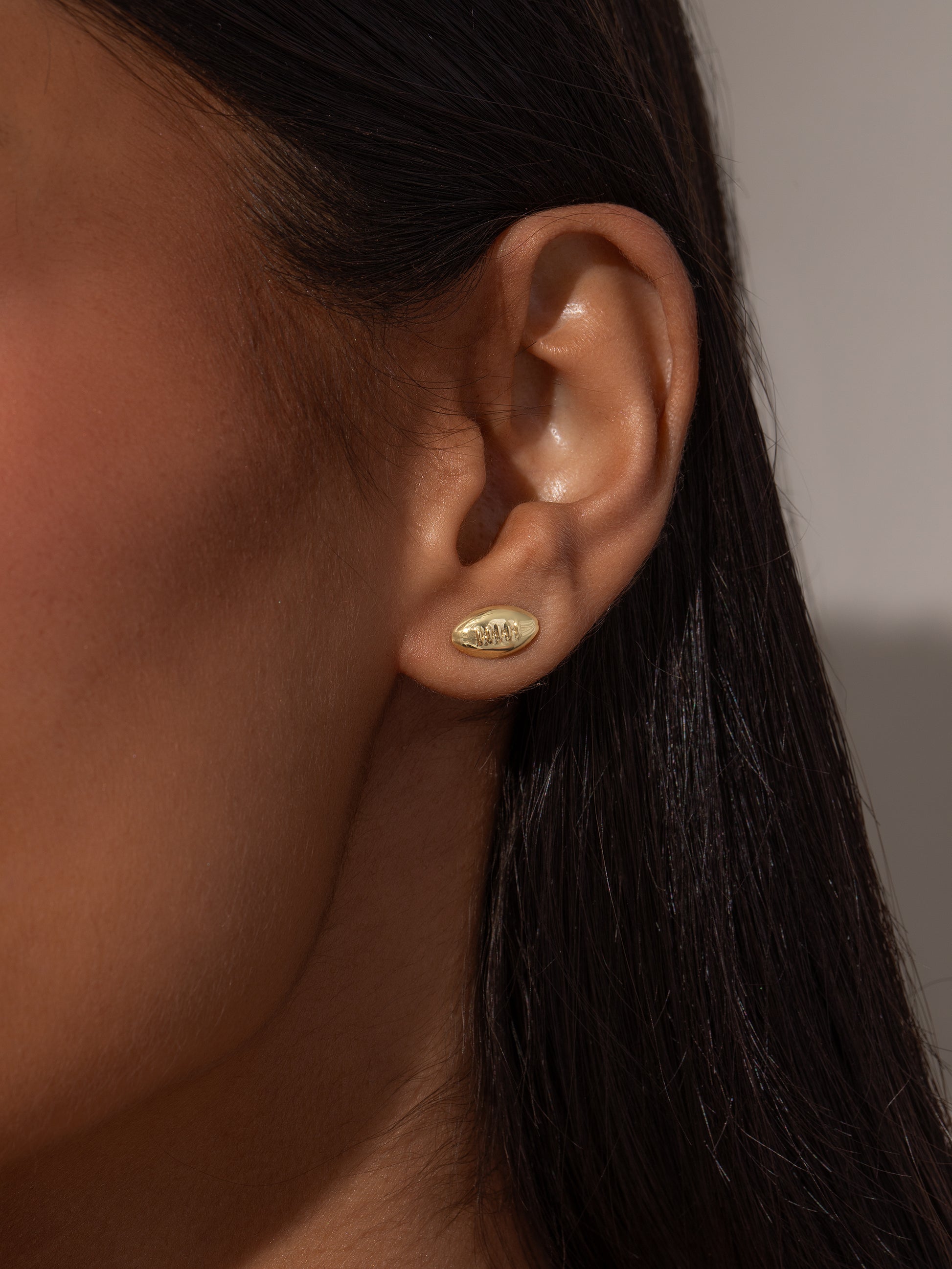 Football Stud Earrings | Gold | Model Image | Uncommon James