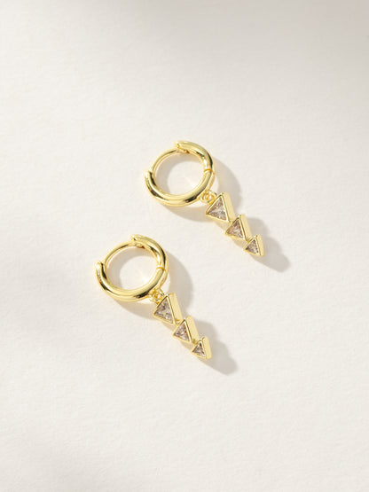 Moving On Arrow Huggie Earrings | Gold | Product Image | Uncommon James