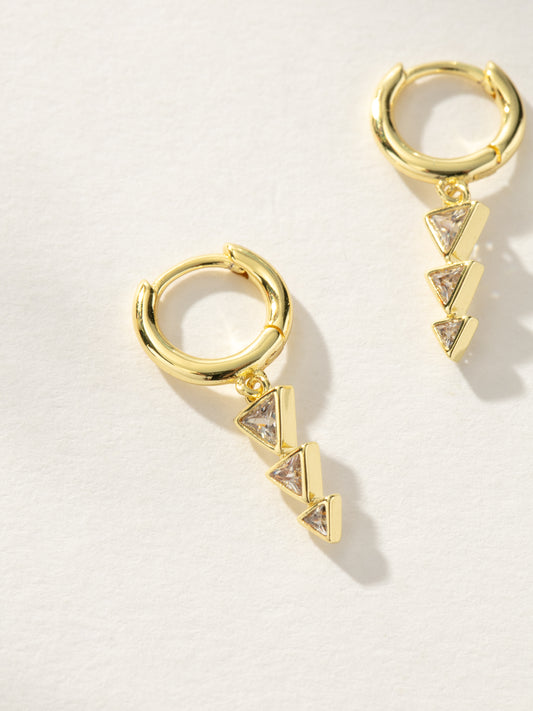 Moving On Arrow Huggie Earrings | Gold | Product Image | Uncommon James
