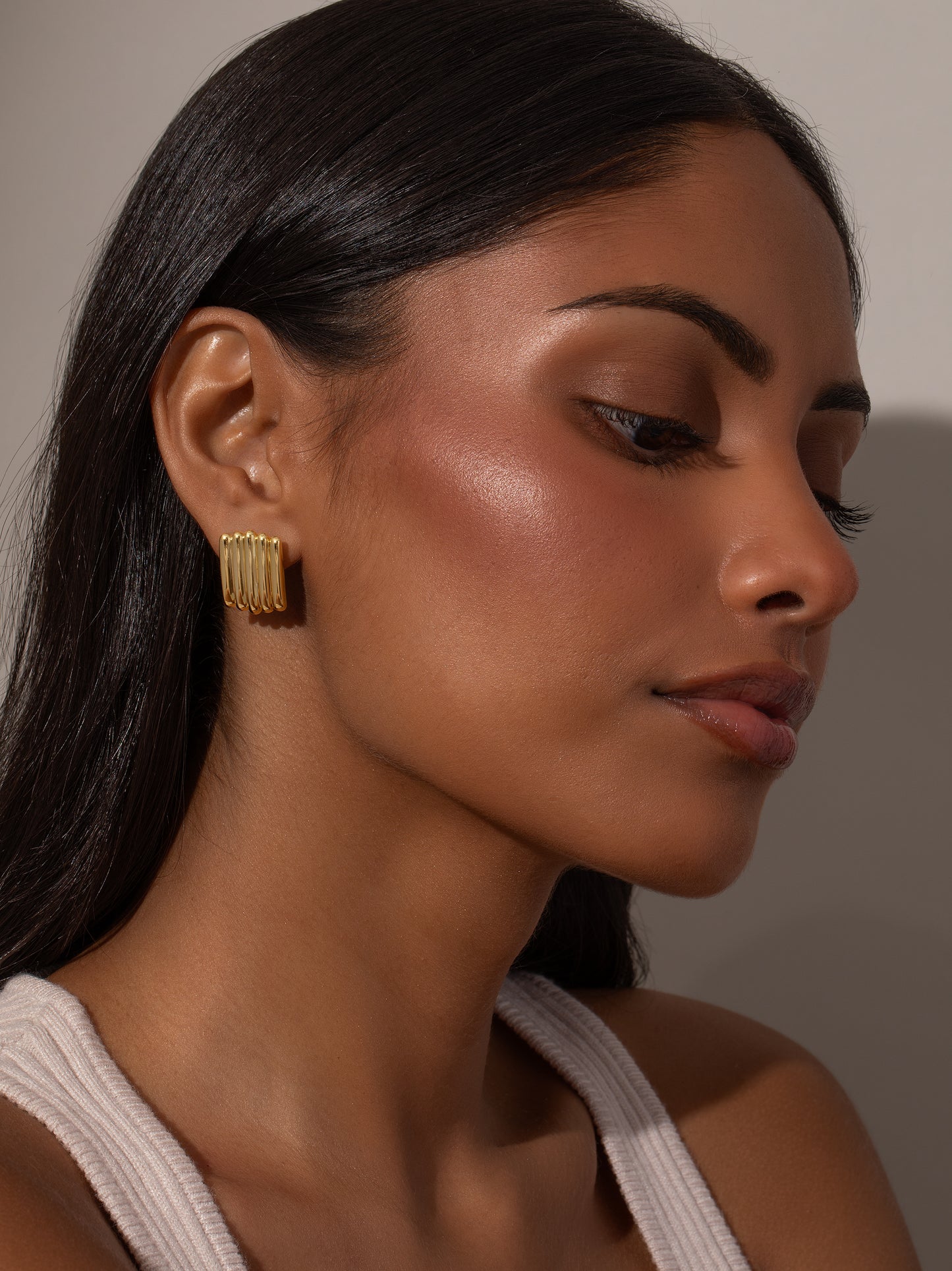 Tough Ribbed Statement Earrings | Gold | Model Image 2 | Uncommon James