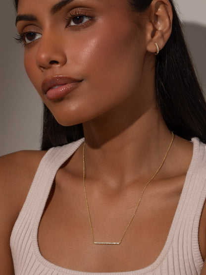 ["Blinding Lights Horizontal Bar Necklace ", " Gold ", " Model Image ", " Uncommon James"]