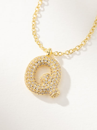 ["Bubble Letter Necklace 2.0 ", " Gold Q ", " Product Image ", " Uncommon James"]