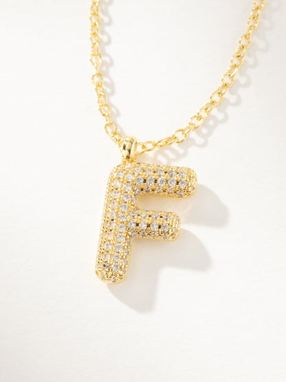 ["Bubble Letter Necklace 2.0 ", " Gold F ", " Product Image ", " Uncommon James"]